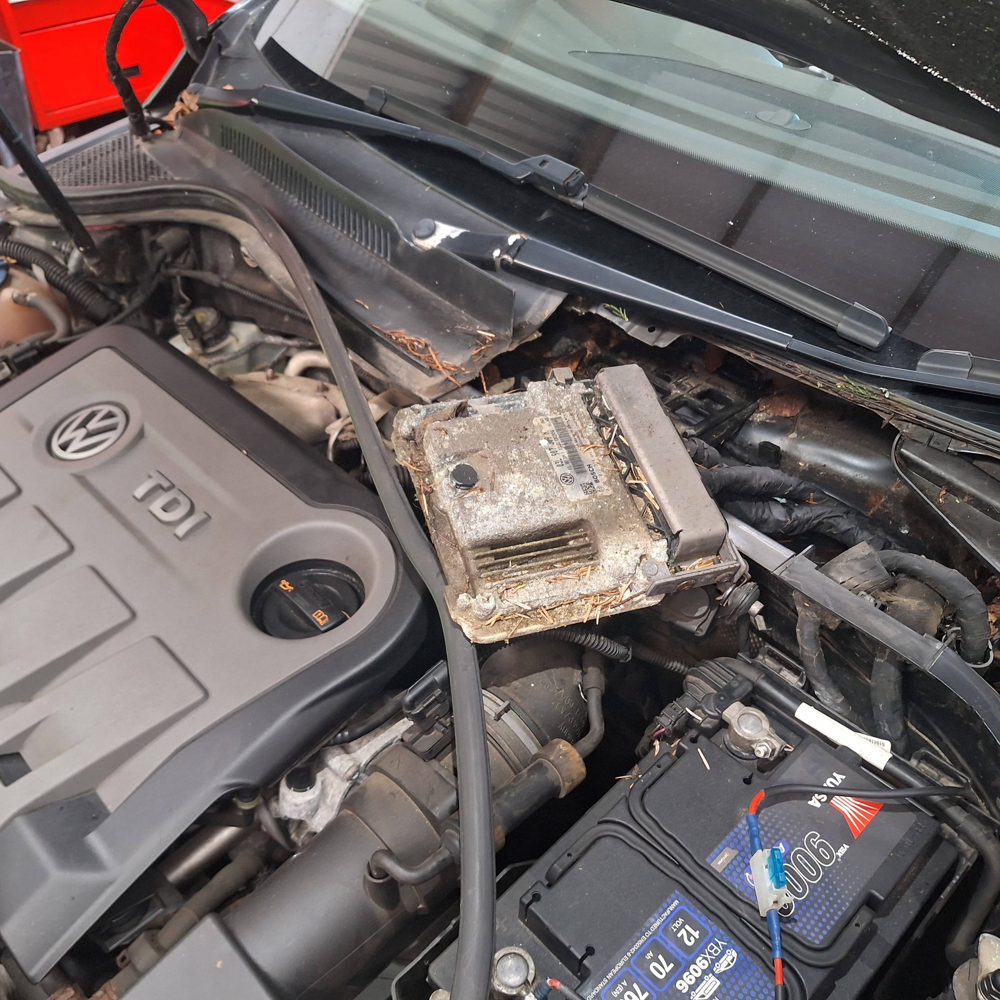 Engine bay with corroded ECU